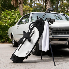 Lightweight golf stand bag with cooler pouch on cart path morning round